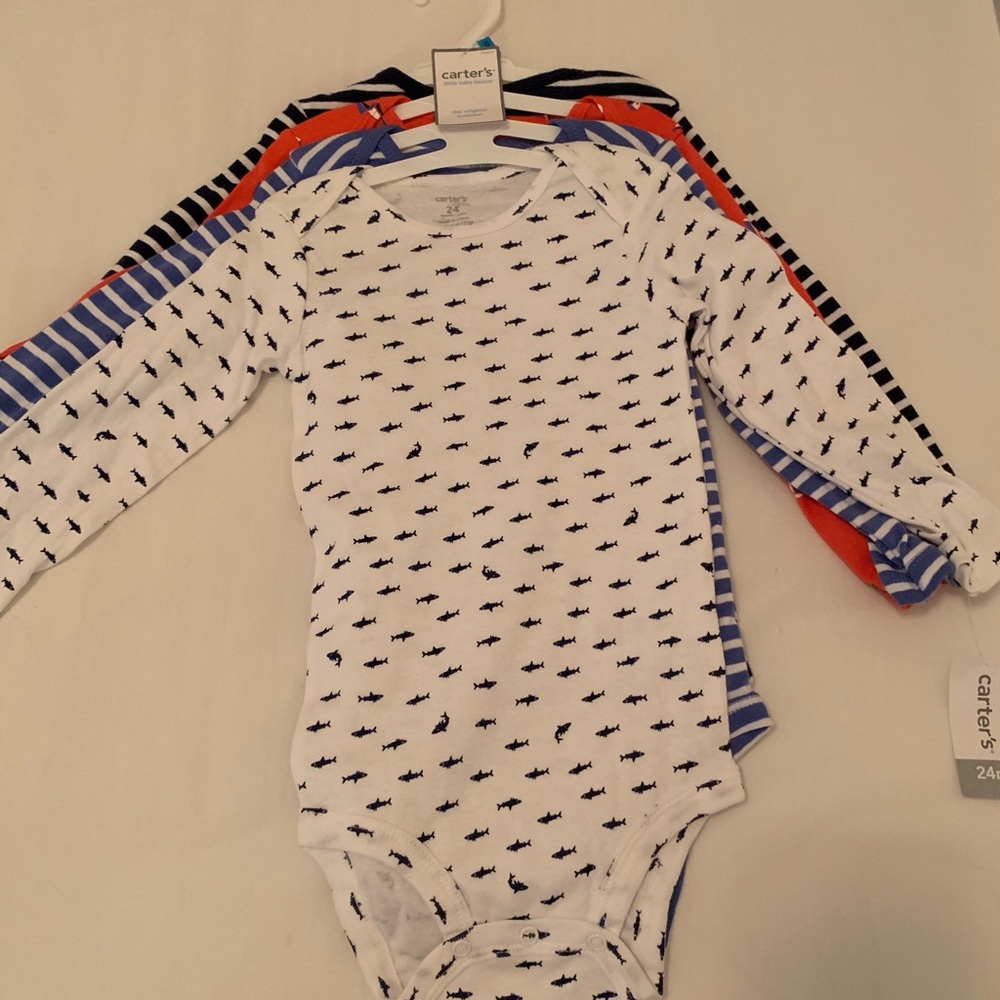 Pack of four 24 month bodysuits. New with tags